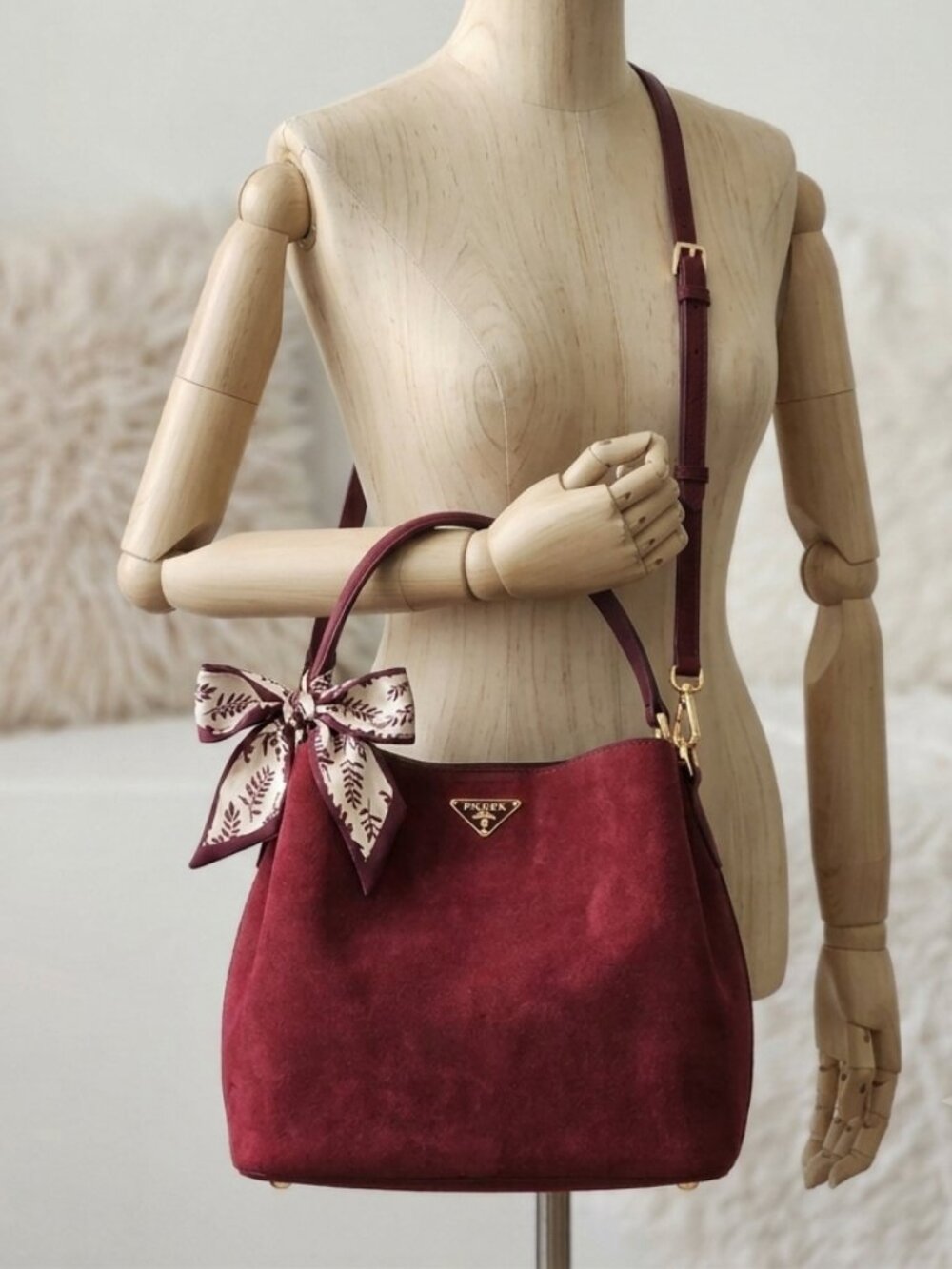Stylish P burgundy bag.